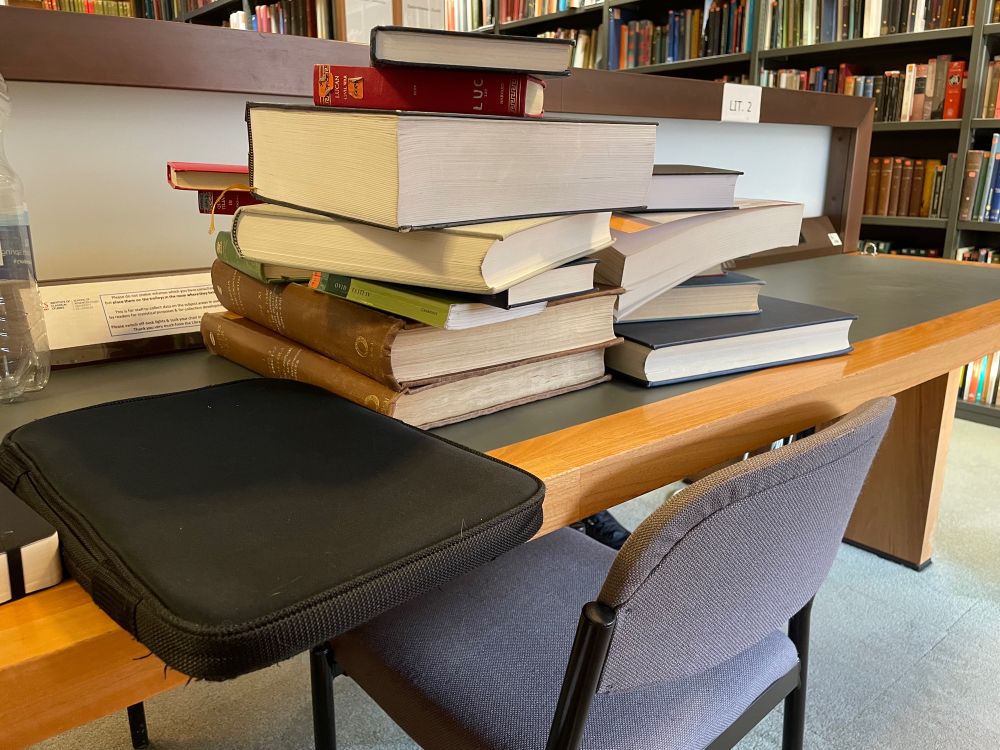 A stack of books in the Institute of Classical Studies library. To avoid precarity, the books are in fact in three stacks.