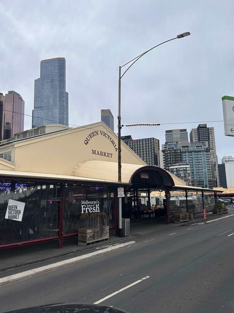 The frontage of the Queen Victoria Market with the Melbourne Skyline in the background 