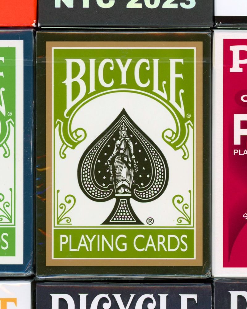 A scan of several playing cards. Bicycle Rejuvenate Playing Cards is seen in the center.