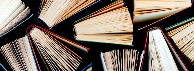 a collection of hardcover books seen from above