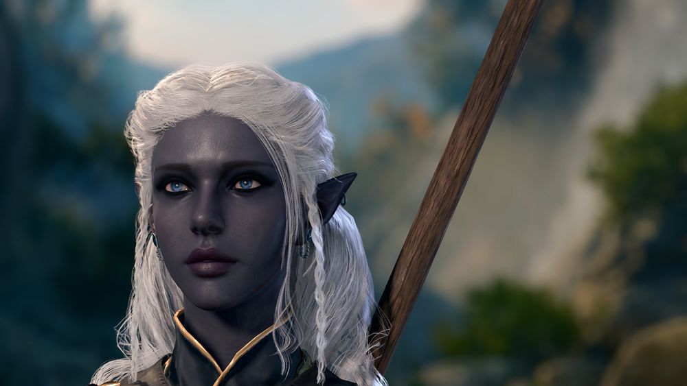 screenshot of bg3. it pictures a drow woman with dark blue/purple skin, with white hair that has portions pulled up into braids. her eyes are a piercing blue, and her ears and pierced in many places.