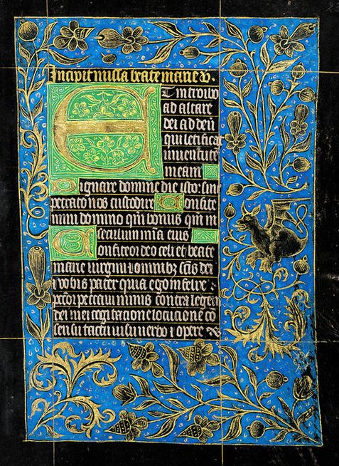 "Mass of the Virgin" (Fols. 22v–23r). A large gold initial against a green field and a small black and gold dragon are key features of this folio.