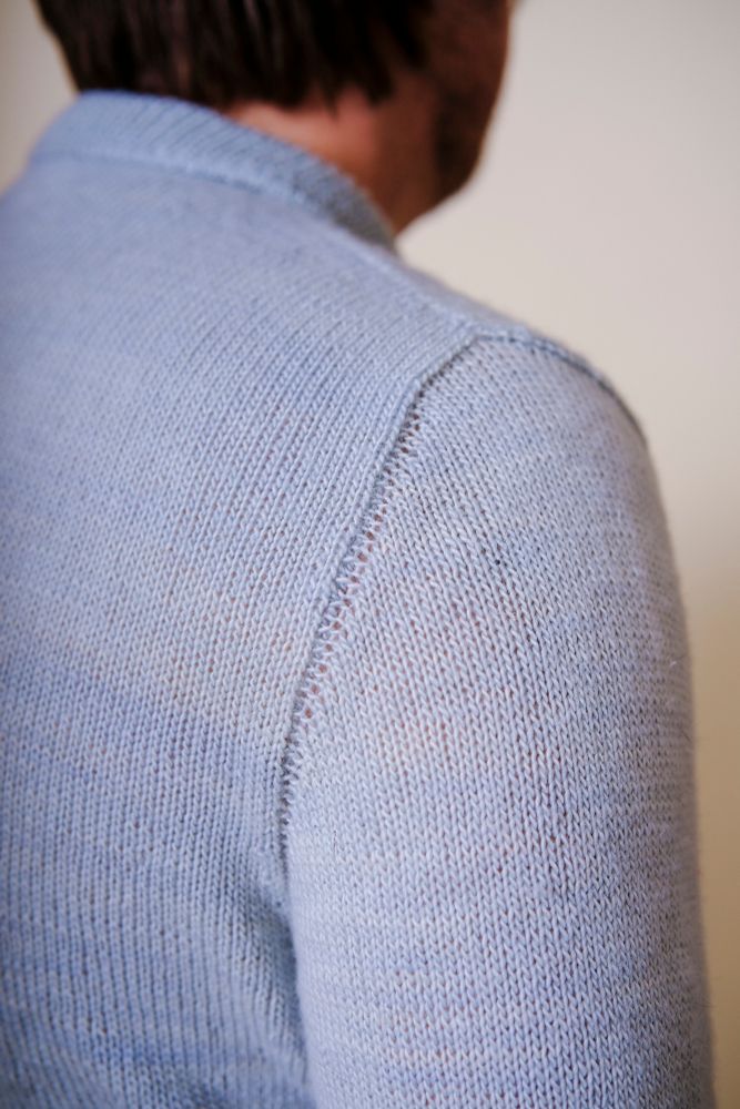 The view of the set-in sleeve of the polo from the back