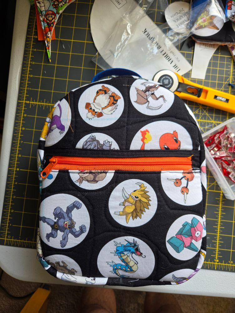 A quilted pokemon backpack
