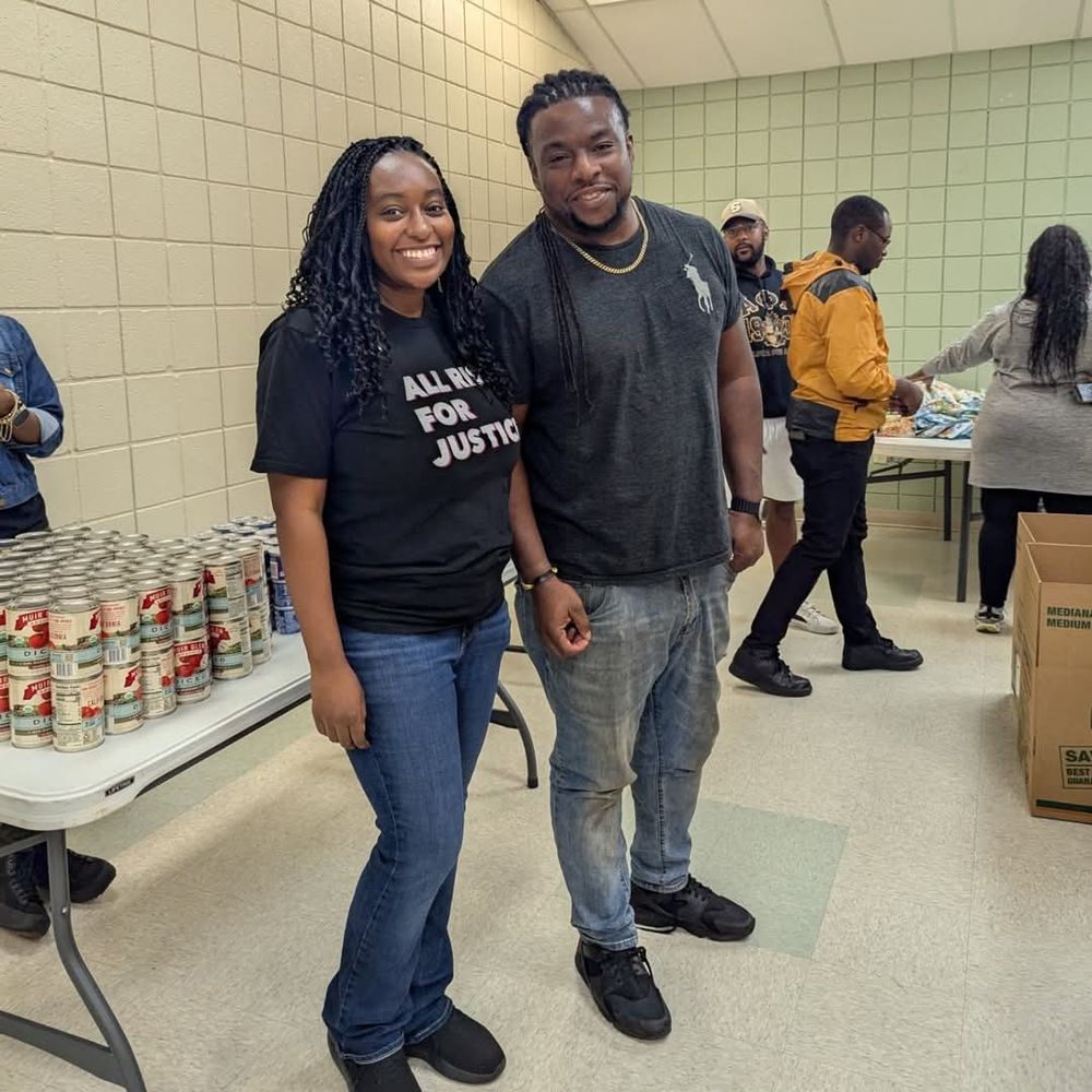 Michelle handing out food to the poor