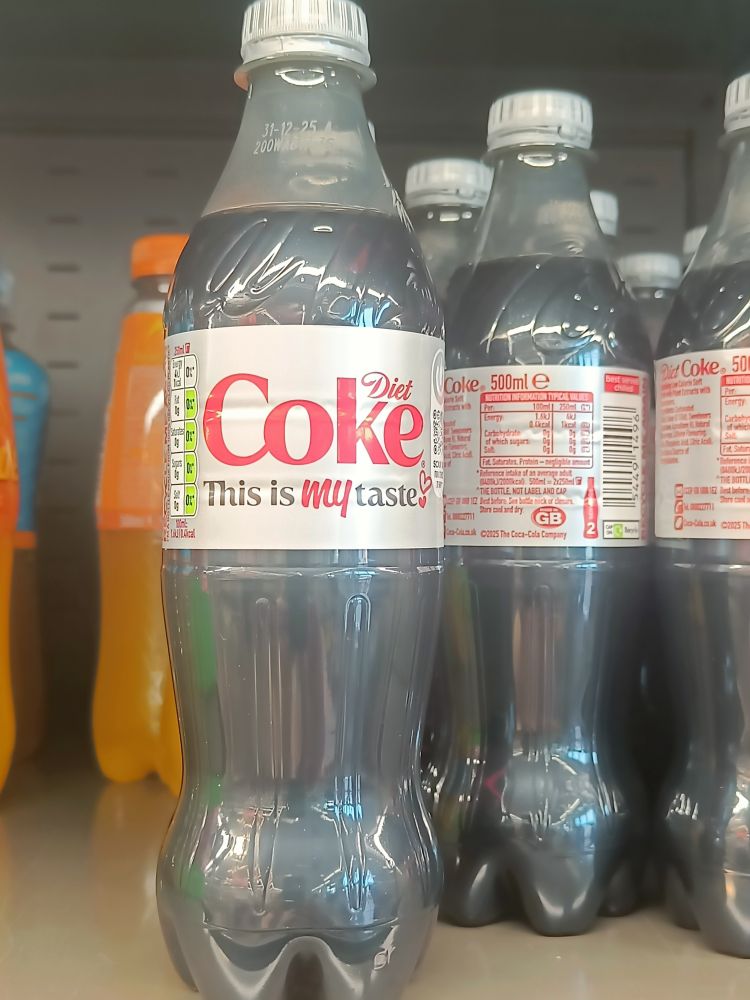 A bottle of diet coke with "this is my taste" as a tagline
