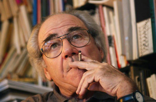 jean beaudrillard smoking and staring whistfully into the middle-distance 