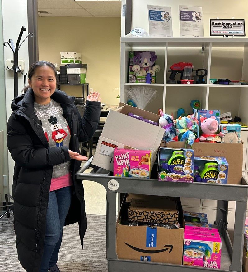 Kim with a cart of adapted toys.