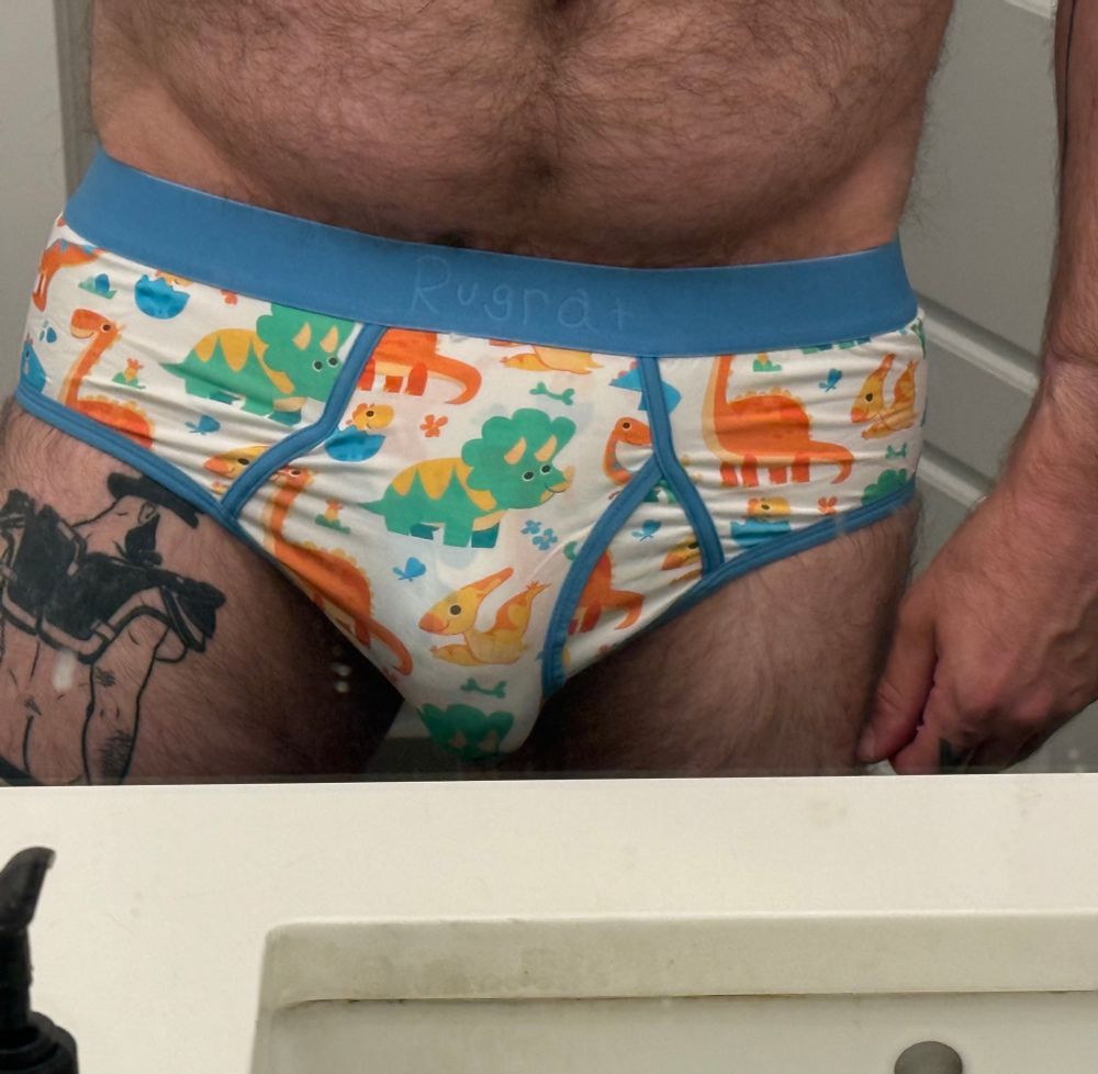 Dan is wearing Dino print briefs 