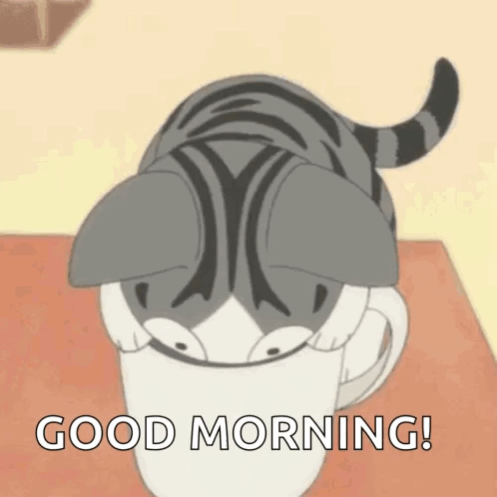 a cat is sticking its head out of a cup of coffee and smiling .