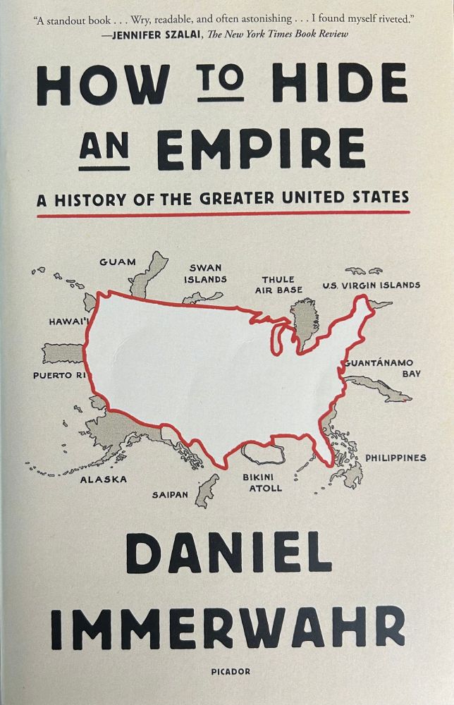 The book cover for Daniel Immerwahr’s “How to Hide an Empire: A History of the Greater United States”

The cover features a red outline of the contiguous United States with Alaska, Hawaii, and the many U.S. territories in gray along the outside of the red line.