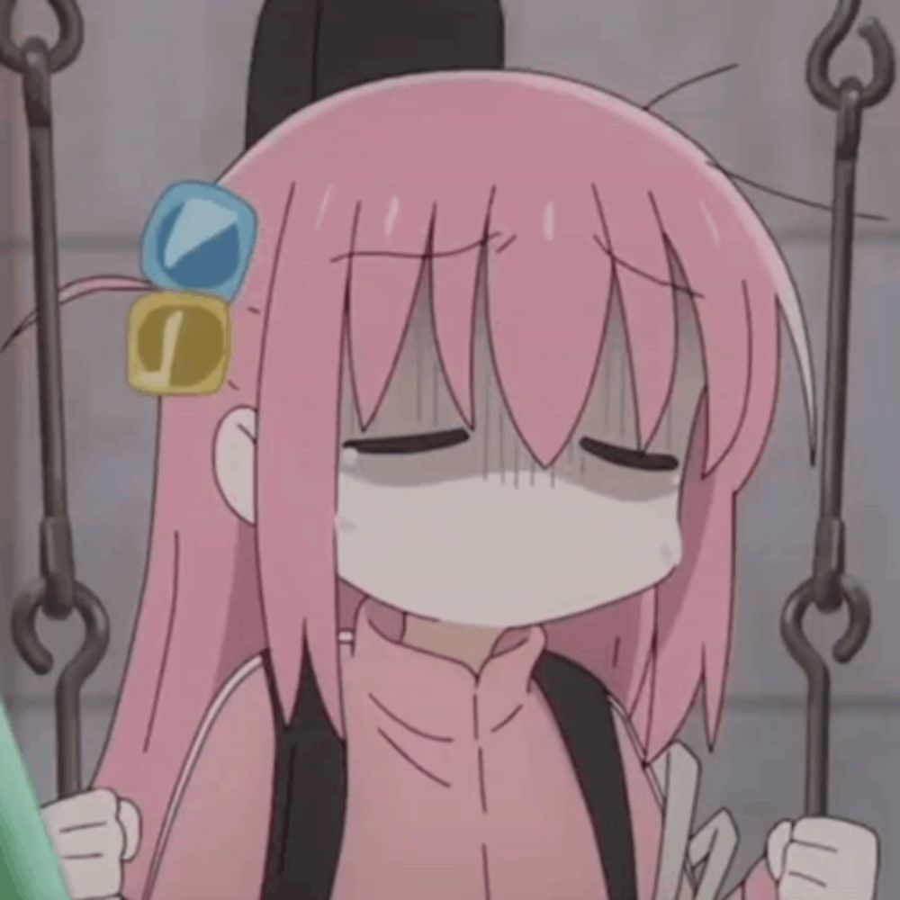 a girl with pink hair is sitting on a swing with her eyes closed and tears running down her face