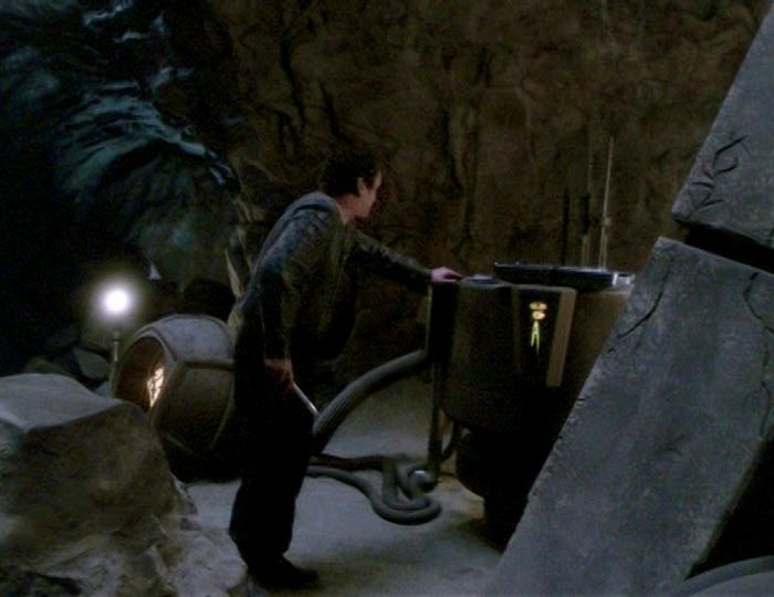 Miles O’Brien (Colm Meaney) in a cave, trying to get the time portal to activate in the Star Trek: Deep Space Nine episode “Time’s Orphan”.