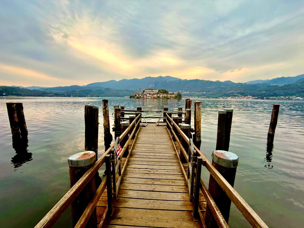 Boat dock at Lago d’Orta with a view on isola San Guilia