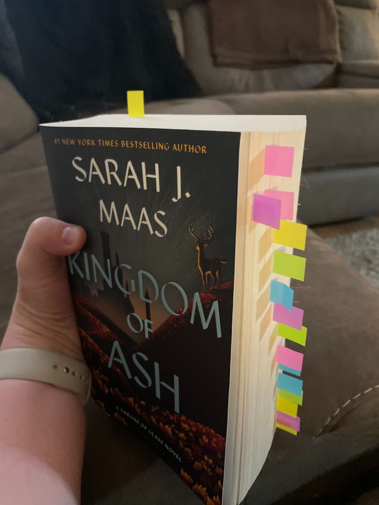 Photo of my Kingdom of Ash book with lots of annotation flags