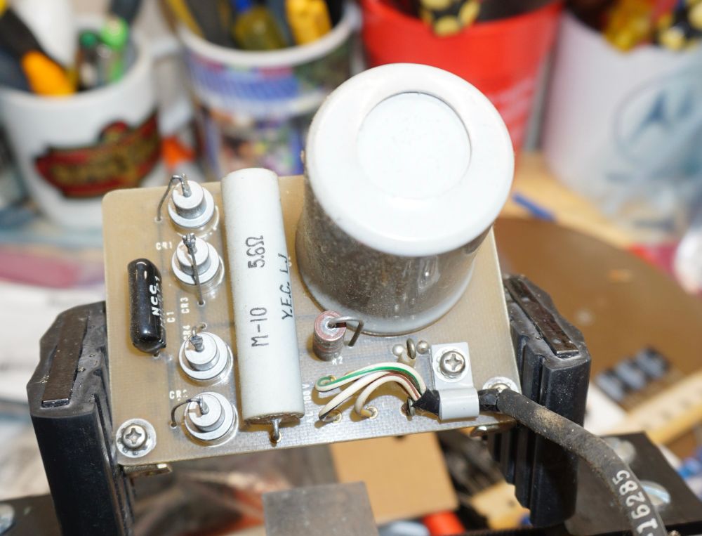 A board with a big can capacitor 