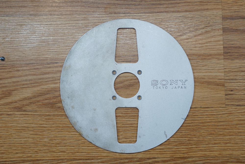 The takeup reel half polished to show the difference and how much the rubbing compound helps.