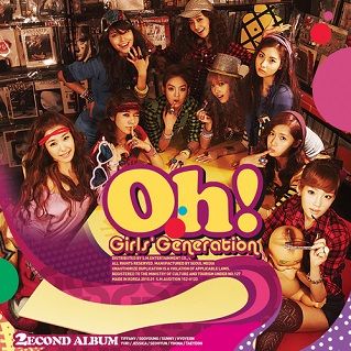 Album art for Oh! by Girls' Generation. The nine Girls sitting around in a small shop.  