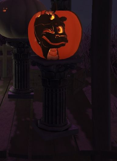 Same carved pumpkin on a pediestal