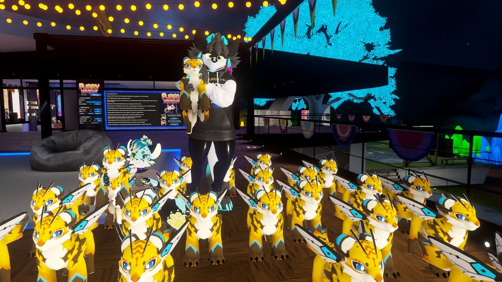 A kobold and a cat in a large group of small Tigerbees, they are both holding one