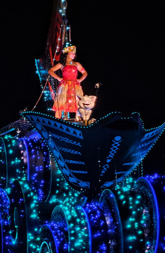 Disney Starlight parade at Magic Kingdom featuring Moana standing on her float with Pua