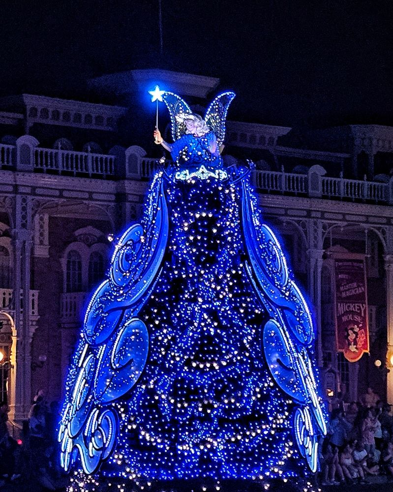 Disney Starlight parade at Magic Kingdom featuring the opening float with the Blue Fairy and Pinocchio 