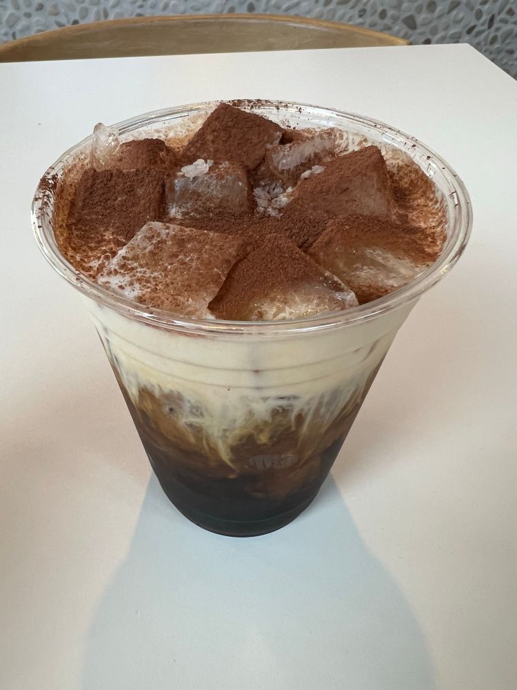 Cold brew with salted cold foam topped with cocoa powder