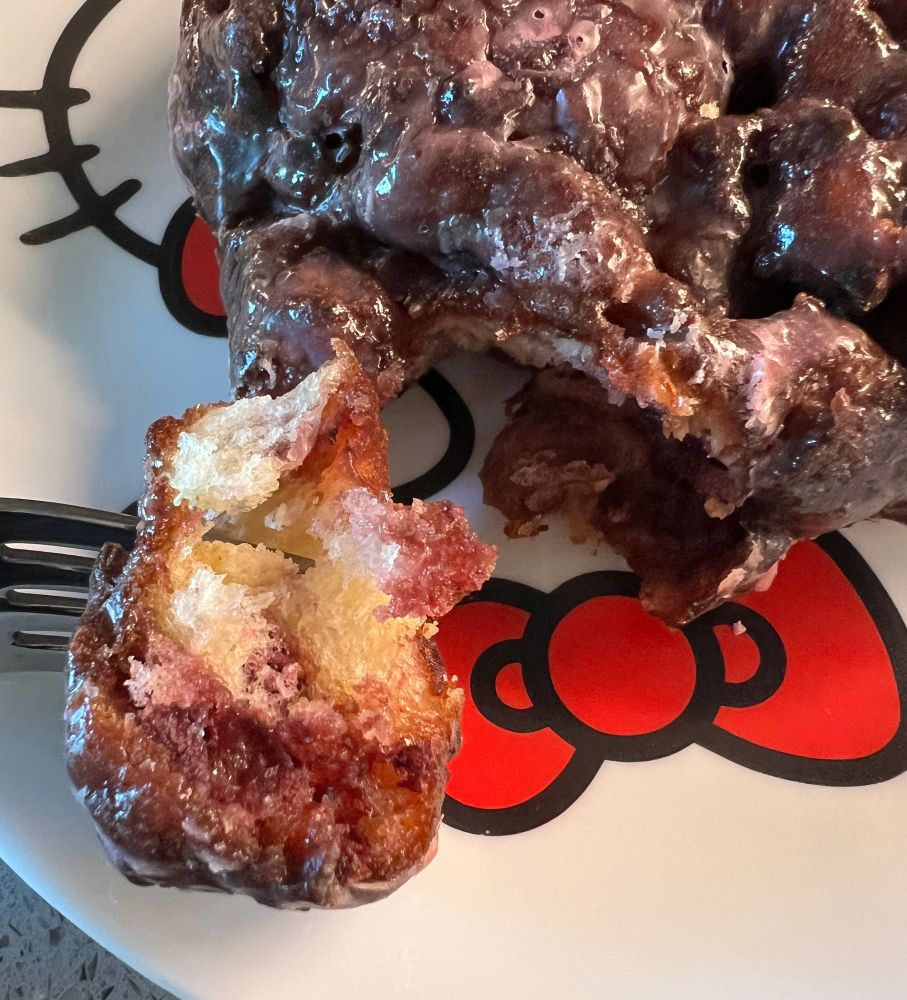 Piece of blackberry fritter filled with blackberries