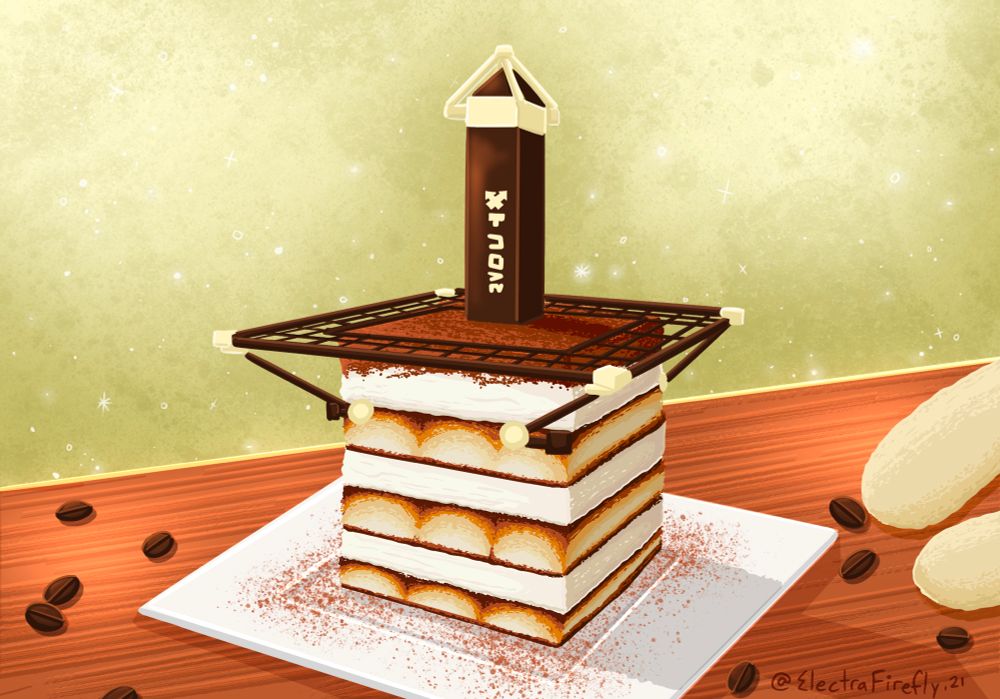 A tiramisu in the shape of a Splatoon Anarchy Mode Tower Control tower. It’s powdered with mocha powder and filled with cream and lady fingers. The grate is made from a molded chocolate. Coffee beans and lady fingers are scattered on the table surrounding it.