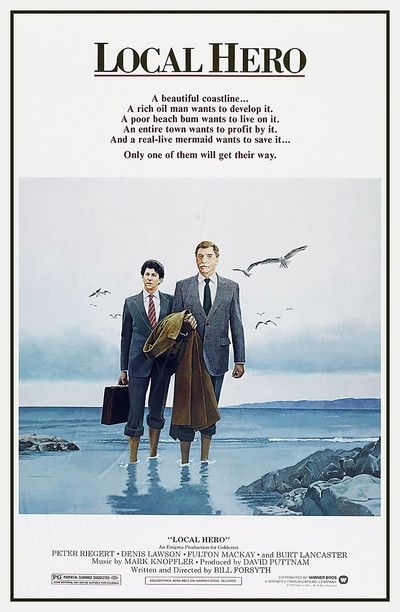 Movie poster for Local Hero.
Two men in suits with rolled-up trousers stand in the shallows of the sea.