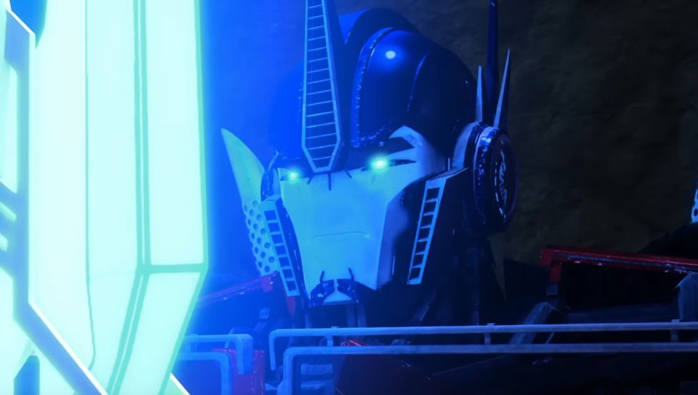 Another shot of him staring at the sword. His expression looks more focused. 