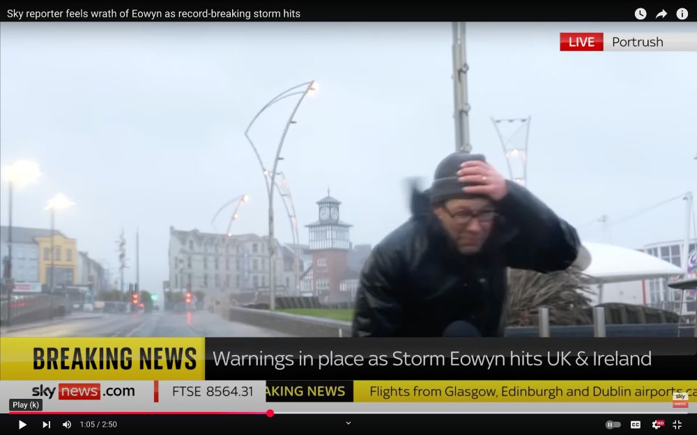 The Sky News science correspondent, trying hard to keep his hat and feet as he stands in the middle of a storm, just so he can tell people that the storm is bad.