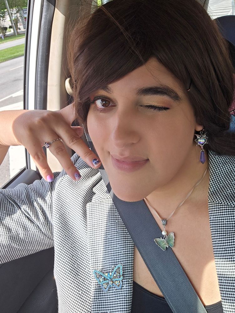 Ira in the car, smiling despite damn near sweating her face off