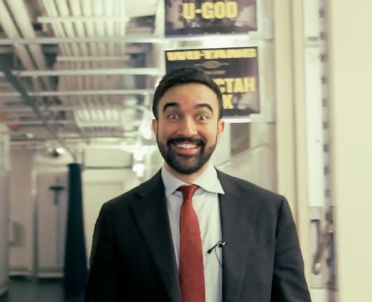 Zohran Mamdani backstage at a Wu Tang concert with a look on his face like "HOW IS THIS MY LIFE??!!!"