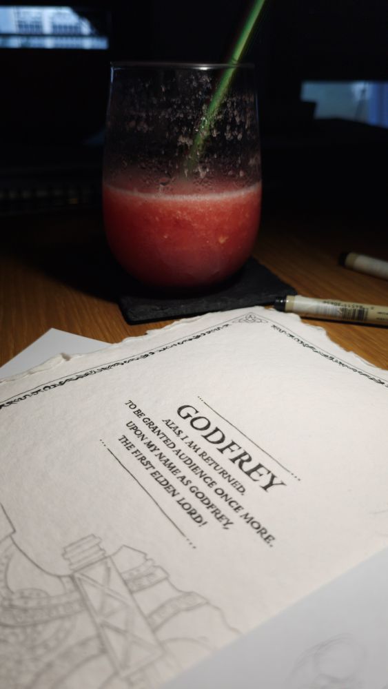 A photo of a watermelon slush and a piece of paper where we can read an inked text: Alas I am returned. To be granted audience once more. Upon my name as Godfrey, the first Elden Lord! 