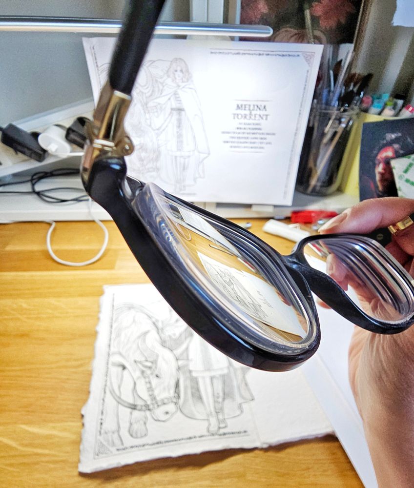 A close up photo of some very thick glasses.
