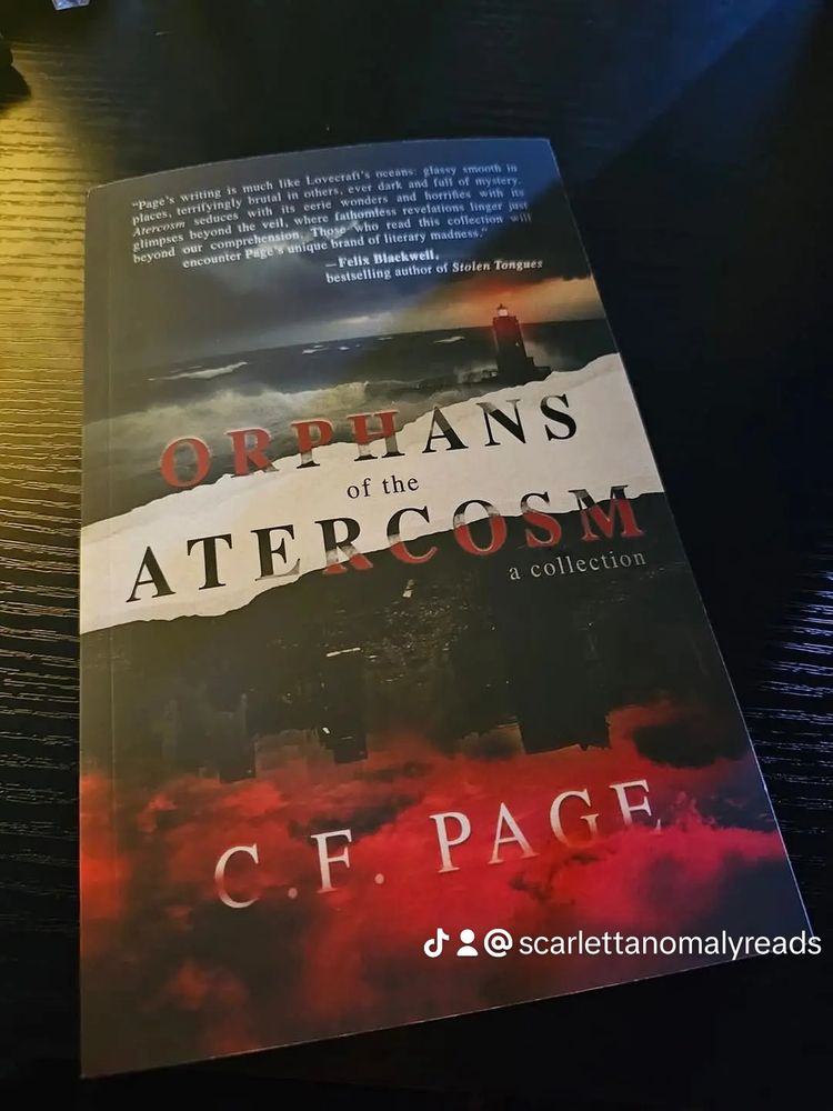 Photo is of Orphans of  the Aftercosom by CF Page
Cover shows a light house at the top on the sea, then a white splash across the cover then the bottom half is all red smoke and evil looking 