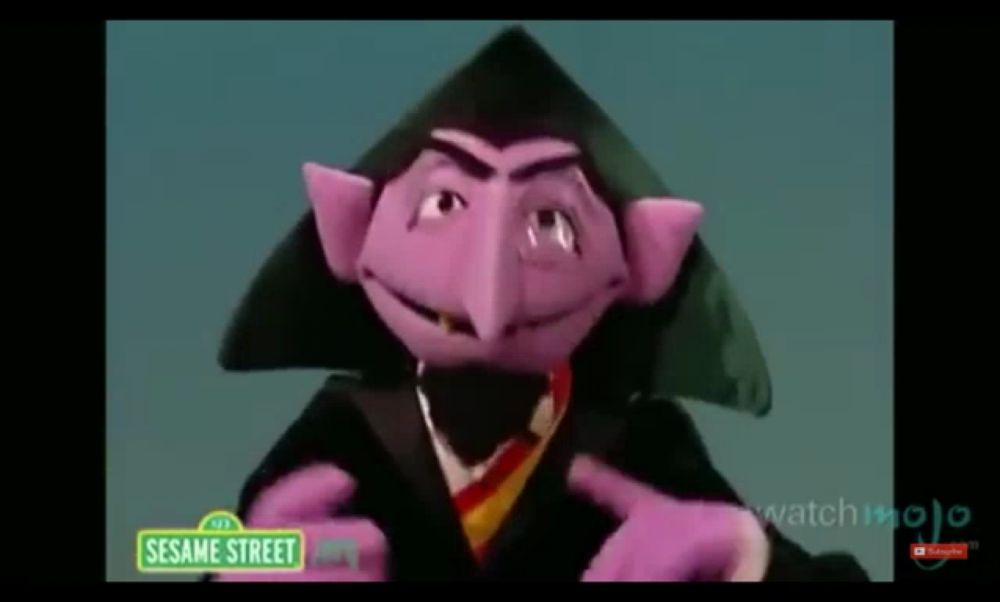 count von count from sesame street is wearing a graduation cap