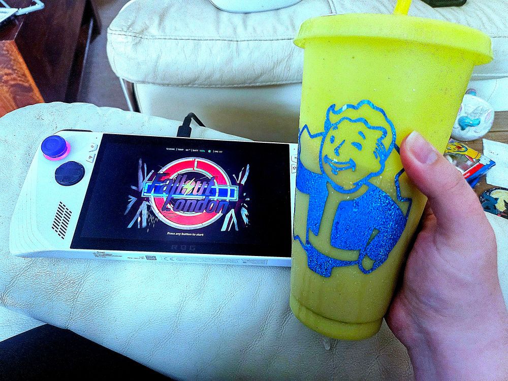 ROG Ally showing 'Fallout London' with a blue and yellow cup 