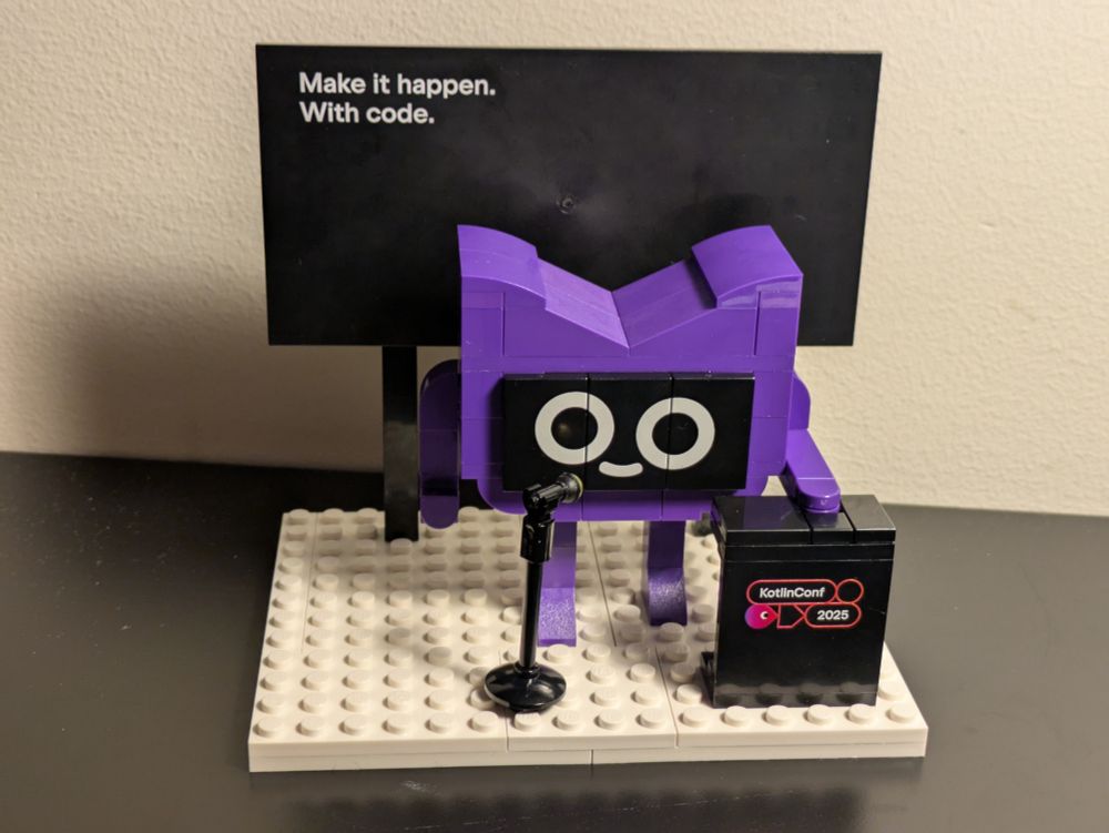 Lego Kodee model standing at a speaker's podium