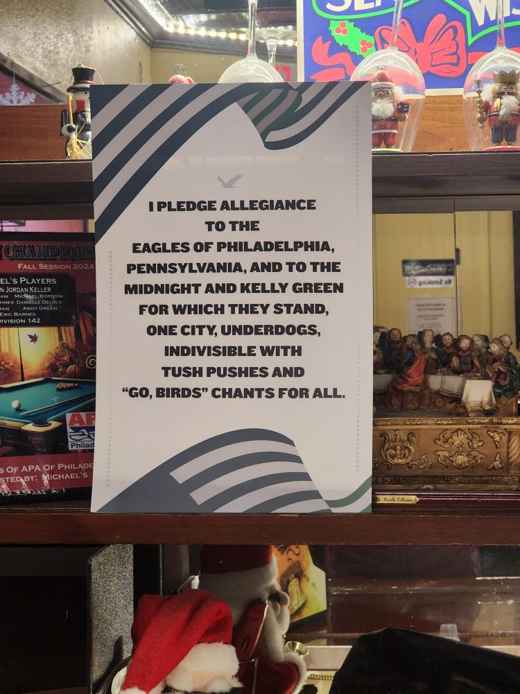 Green and White banner that says: I pledge allegiance to the Eagles of Philadelphia Pennsylvania and to the Midnight and Kelly Green for which they stand. One city, underdogs, indivisible with tush pushes, and #GoBirds chants for all. 