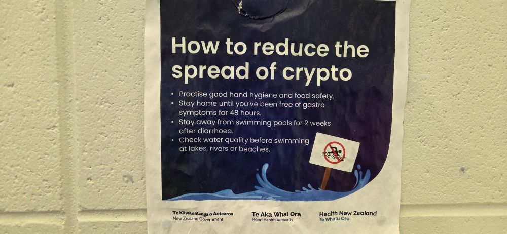 Photo of a poster on the wall titled "How to reduce the spread of crypto" explaining the risk and prevention of cryptosporidium infections.