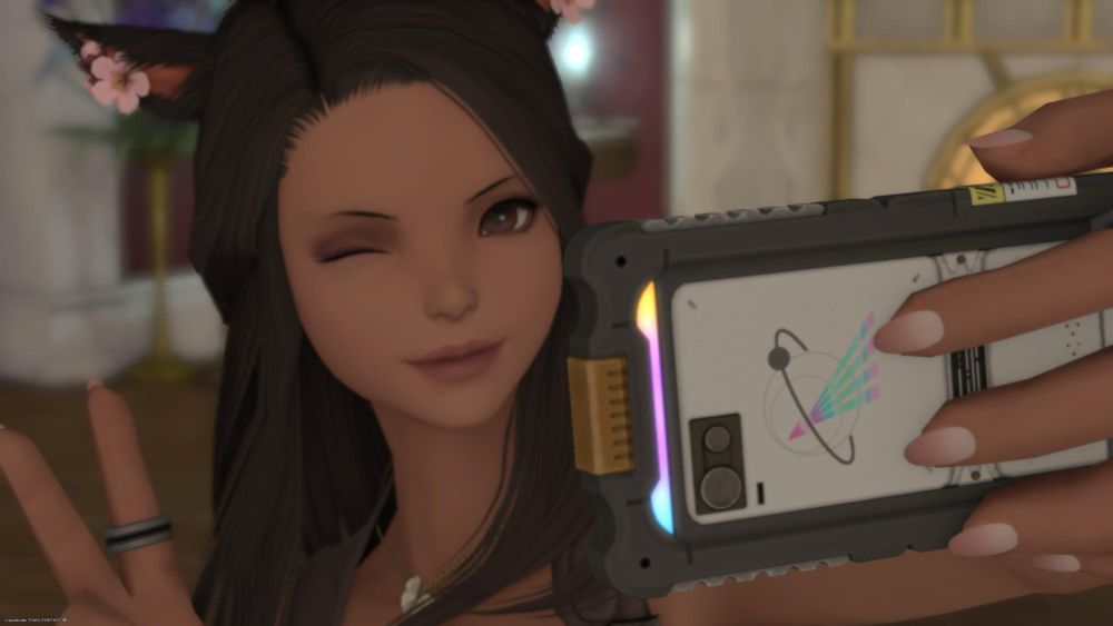 Vye winking and peace signing while taking a selfie