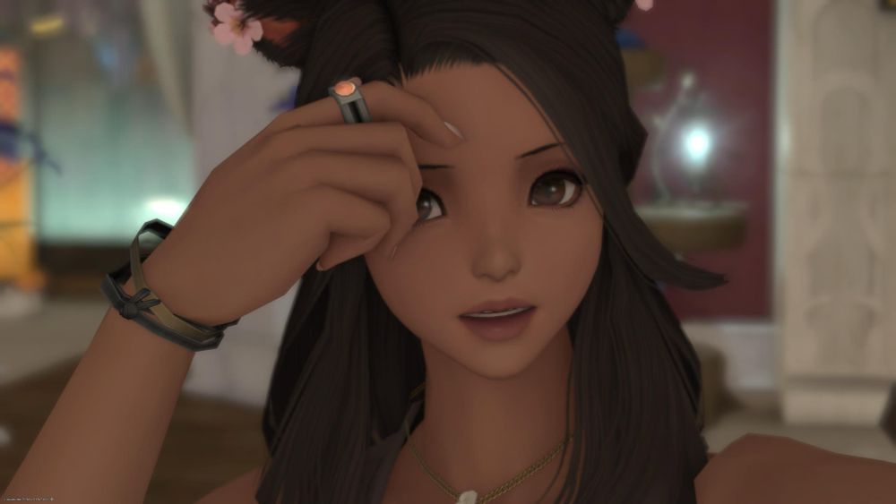 Vye fixing her hair looking very slightly distracted