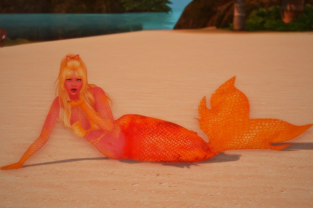 A red and orange mermaid sim blowing a kiss. 