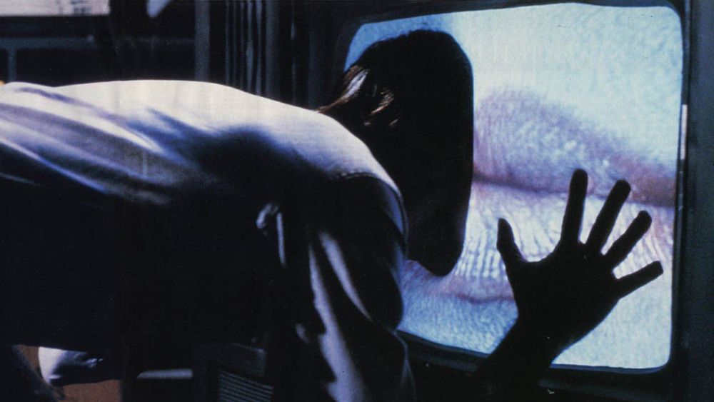 James Woods sticks his face into a TV screen bulging with giant lips displayed in “Videodrome”