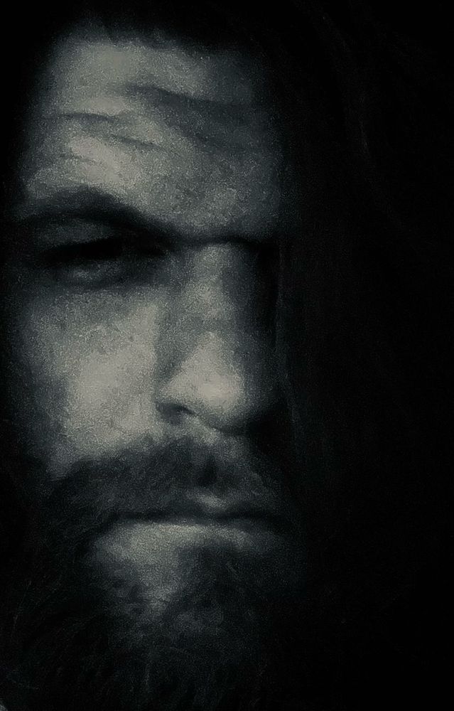 A creepy selfie of a man with a caveman style brow