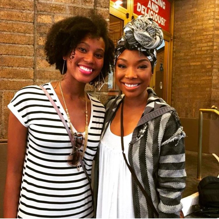 Photo of Brandy and fan smiling. 