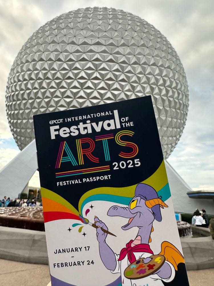 Festival of the Arts guide in front of Space Ship Earth
