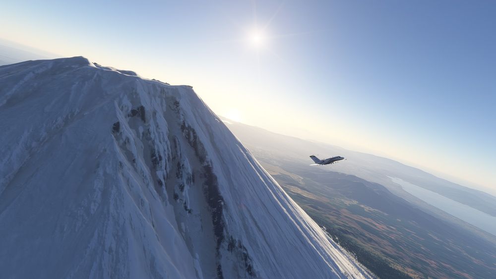 Screenshot from Microsoft Flight Simulator showing the side of Mount Fuji, with my sim plane (a small Cessna one) flying in the background